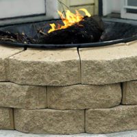 DIY Brick Fire Pit on a Budget - This project is easy to make and because its made of brick it is a sturdy pit. You will have no worries about looters stealing the metal one.