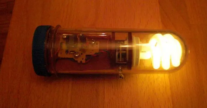 How To Make An Emergency Flashlight From An Old Camera, 2 AA Batteries & Energy Saving Light Bulb - This could be used for camping, bug out bags and at home if the power goes out. Remember, this is not necessarily a flashlight replacement but it gives you the opportunity to learn how you could make one from items around the house.