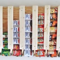 How To Build A Rotating Canned Food Storage System - This DIY project has to be by far the easiest and most clever way to build canned storage! If you have been looking for a way to store your canned food that takes up less space than just putting them on a shelf this project is for you.
