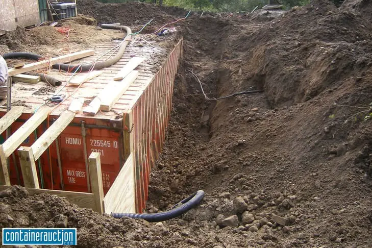 What Happens When You Bury a Shipping Container: walls buckling - use box culvert bunkers