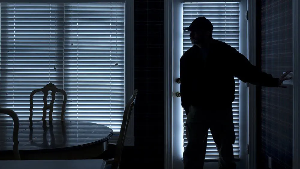 Burglar invading a home through a kicked in door Door Armor Review - Door Armor reinforces weak points on your door and frame and helps secure your door from being kicked in by home invaders or thieves.