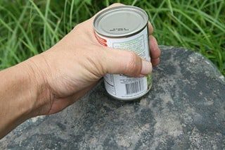 Open Tin Can With Rock