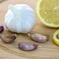 Lemon and garlic on a wooden board