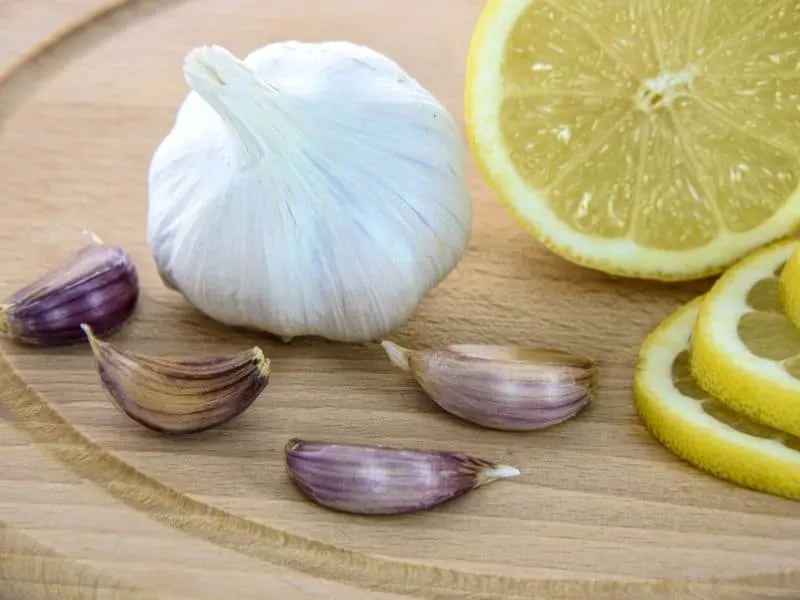 Lemon and garlic on a wooden board