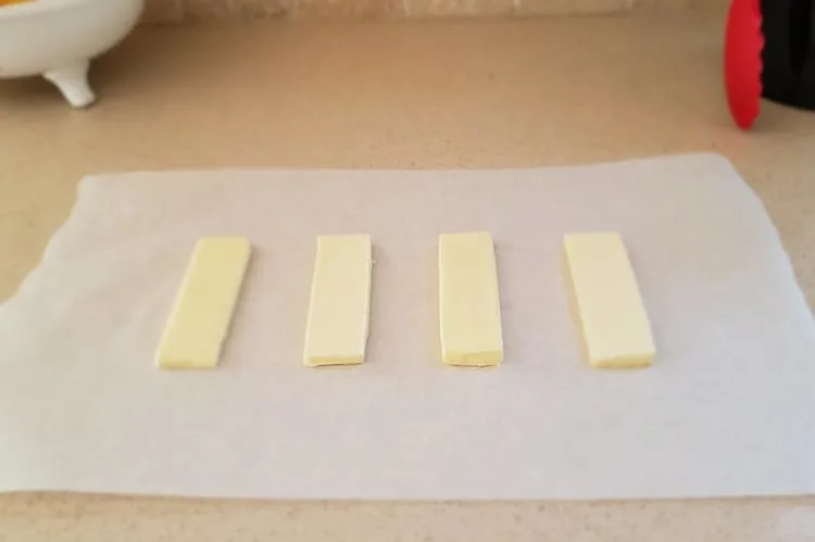 stick of butter sliced horizontally into slabs