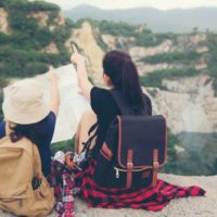 Girl planning a backpacking route with her mom