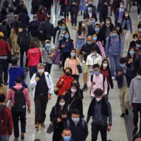 crowd wearing face masks to protect from COVID-19 coronavirus