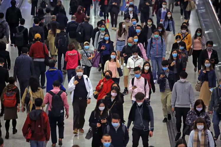 crowd wearing face masks to protect from COVID-19 coronavirus