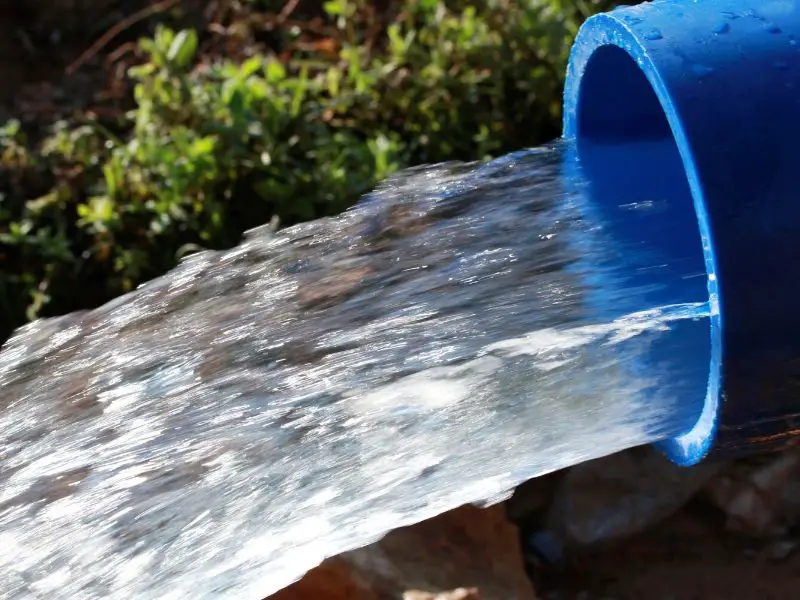 Water flowing out of thick hose