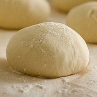 pizza dough in flour