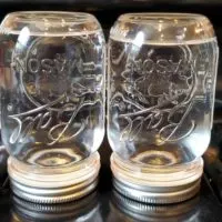 inverted mason jars with water ready for canning
