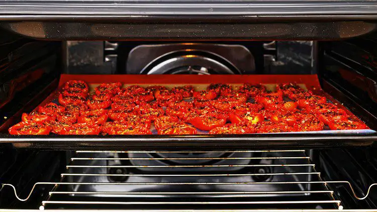 tomatoes drying in an oven