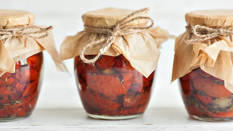 sun-dried tomatoes stored in jars and oil
