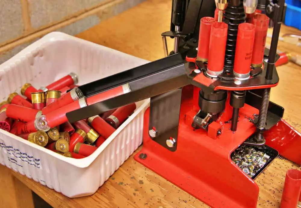 Shotgun shells being refilled in press