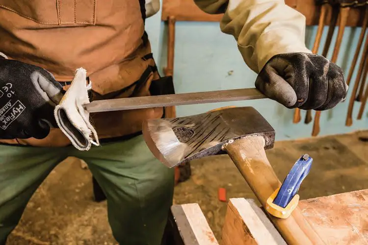Discover How to Sharpen an Axe With These Expert Tips 2 Ensure the axe is upright to be comfortable working with the blade's edge
