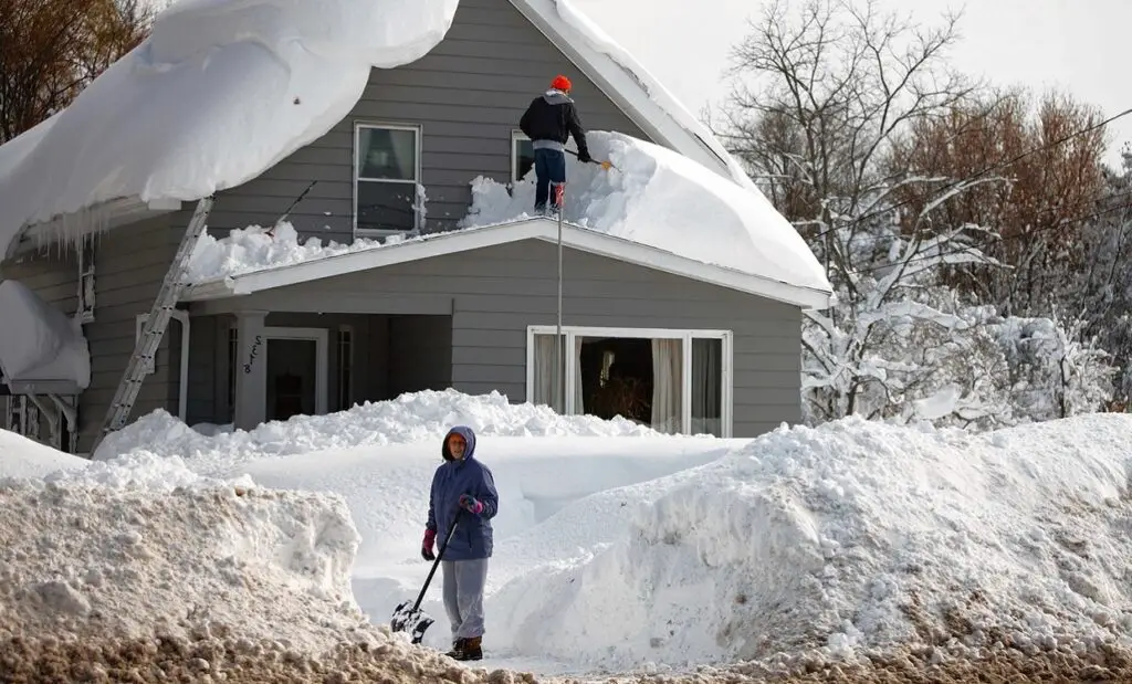 Cleaning snow from roof