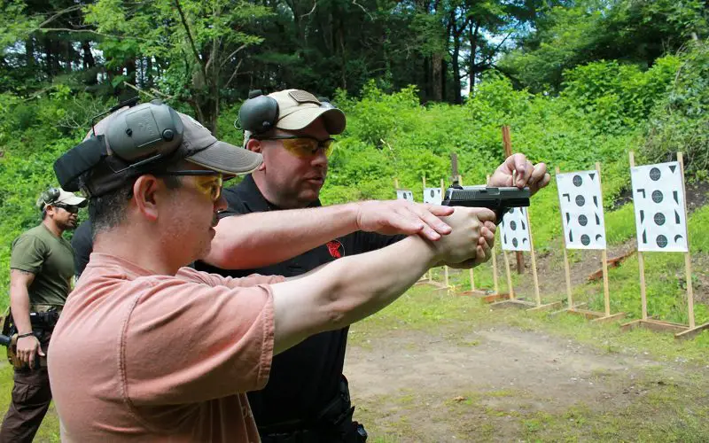 Pistol Shooting Tips: Boost Your Skills with Proven Methods 3 training a pistol shooting with paper targets