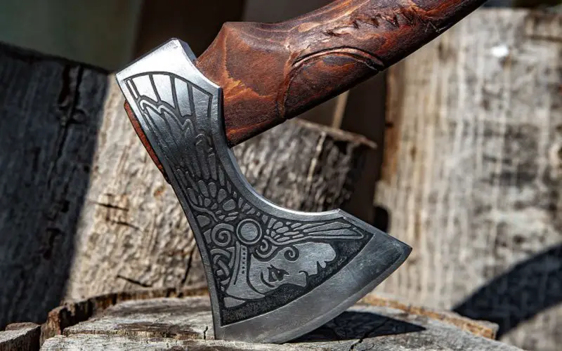 Best Camping Hatchets for Your Outdoors Adventure 10 using hatchet on wood