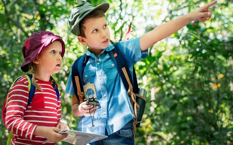 9 Camping Activities for Kids: Make Memories in Nature 8 kids on a scavenger hunt while camping