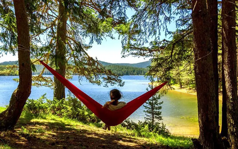 Hammock Camping: 10 Tips for Safety and Survival 3 sitting in hammock