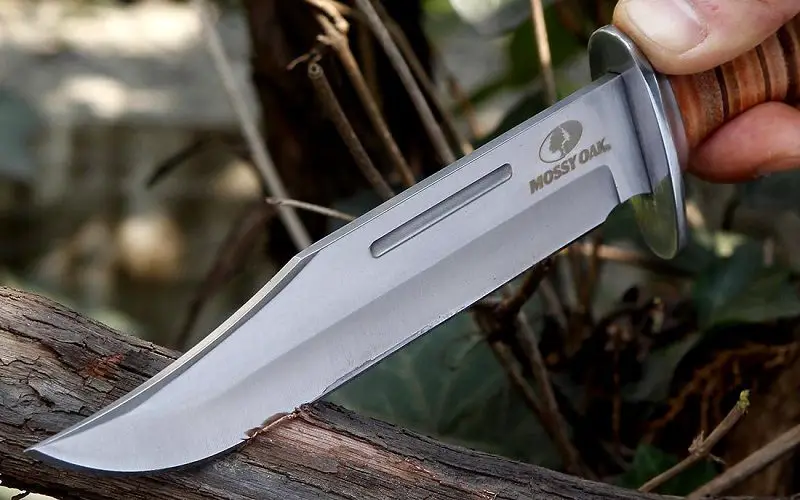 Best Hunting Knives: Superior Craftsmanship & Functionality 10 cutting wood with knife